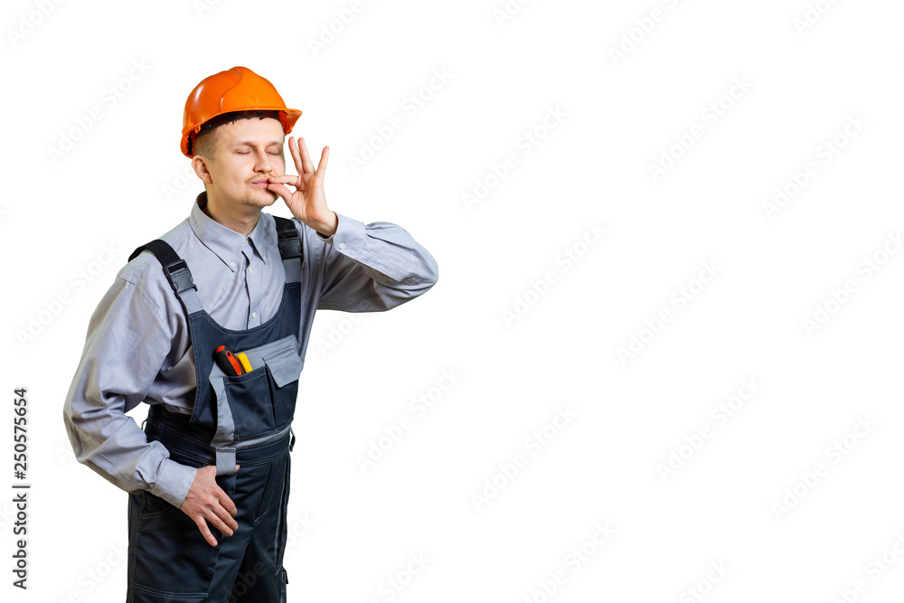 The builder and the working engineer show with a hand gesture that he has made a quality repair or made a penthouse from your apartment. isolated The builder and the working engineer show with a hand gesture that he has made a quality repair or made a penthouse from your apartment. isolated