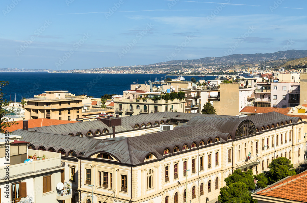 Aerial view of houses, streets and the Strait of Messina between Reggio Calabria and Sicily from the Aragonese Castle in Reggio Calabria, Italy