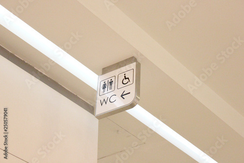 An entrance to the male, female and disabled toilet. wc symbol on wall