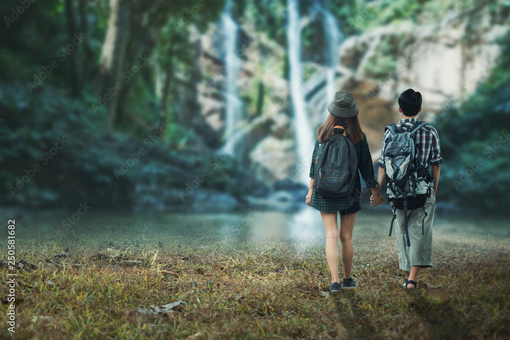 Fototapeta premium Young couple in love holding hand together walking