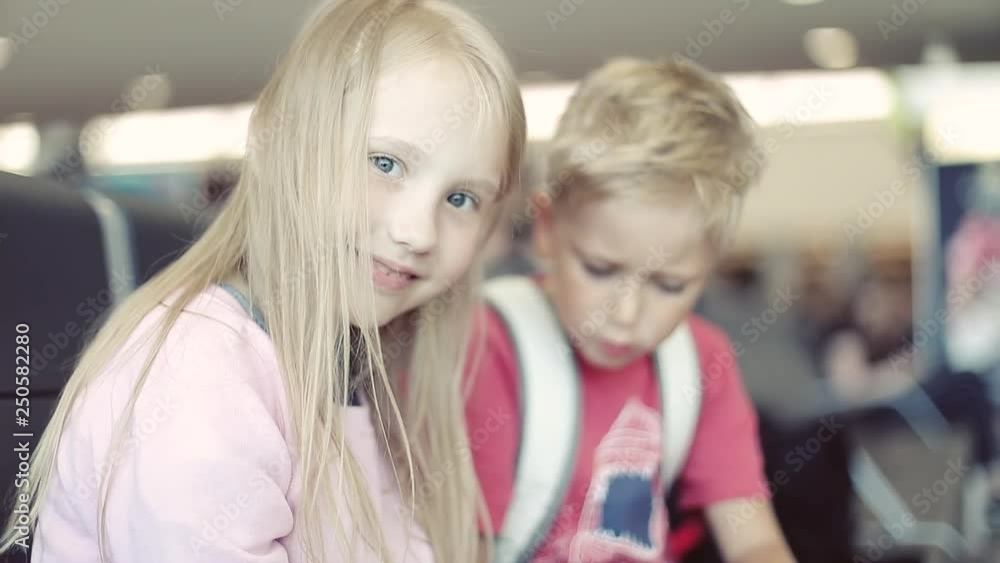 Children play on the mobile phone at the airport. Children play on the mobile phone at the airport.
