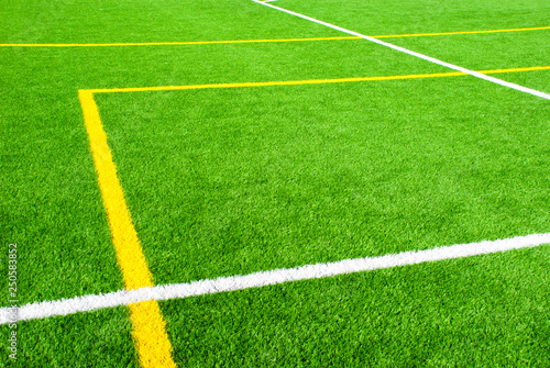Geometric lines on green football field. Abstract sport texture.