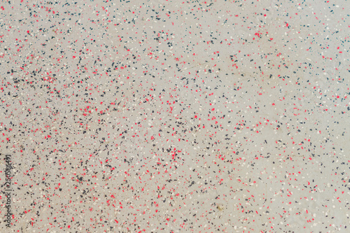 Seamless background texture. Grey concrete floor with red and black dots.