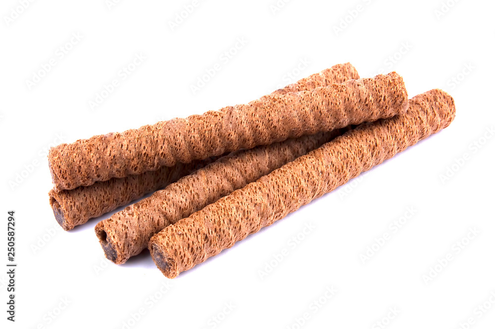 Waffle rolls with chocolate cream on white background Waffle rolls with chocolate cream on white background