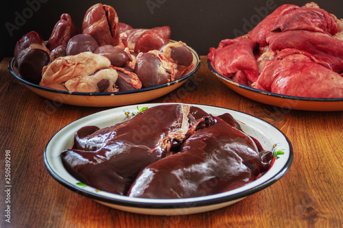 Spread out in bowls, washed, pig insides after cutting photo