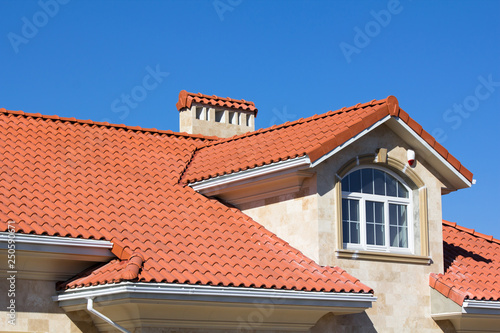 Ceramic Tiled Roof On House photo