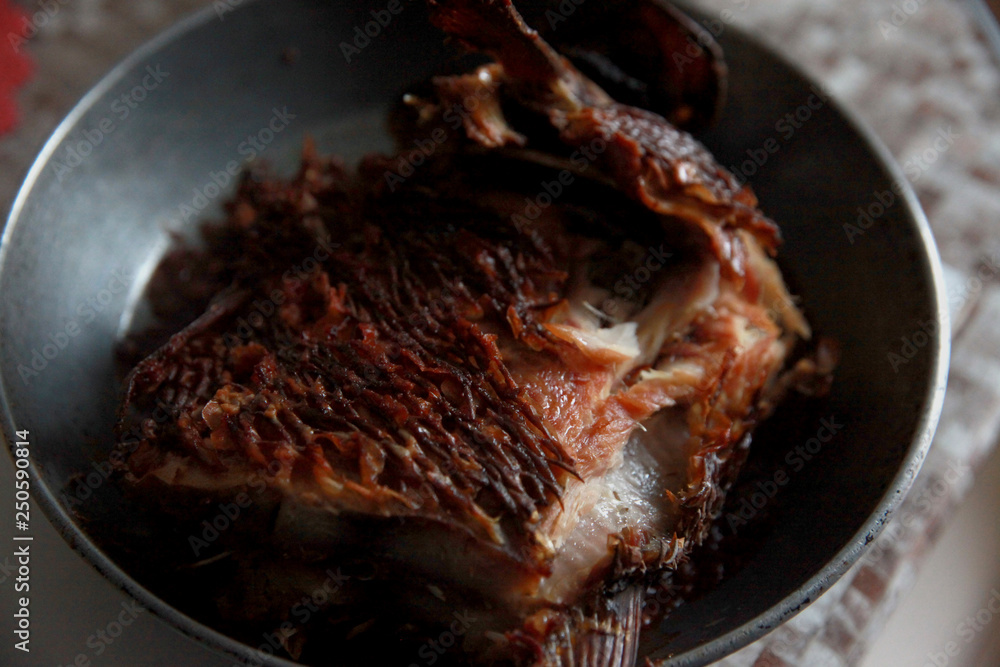 Fototapeta premium cooked salted fish in the pan