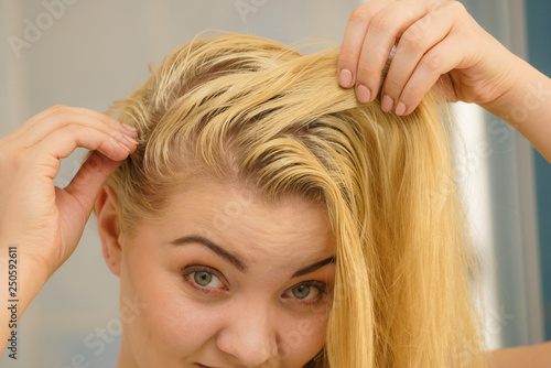 Female having problem with blonde hair