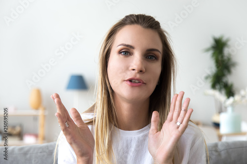 Head shot portrait talking woman, looking at camera, video call