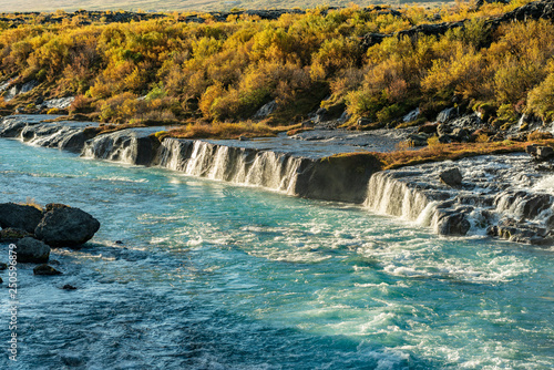 Hraunfossar waterfall in Iceland, in vibrant autumn colors photo