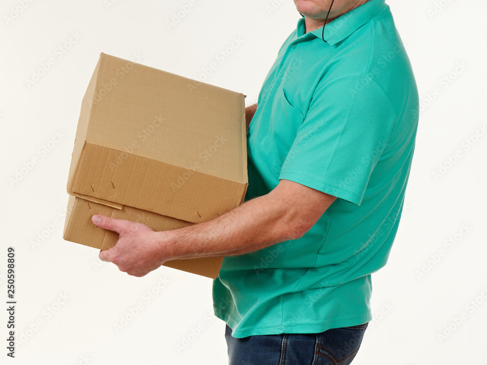man holds in his hands a big box on a white background. man holds in his hands a big box on a white background.
