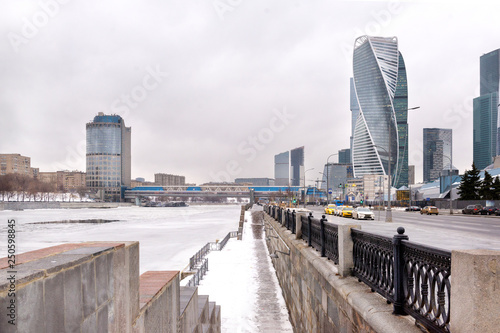 embankment of the Moscow river in winter, Moscow city, river under snow and ice © Elena
