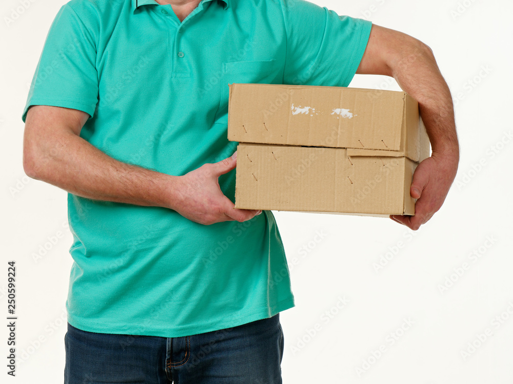 man holds in his hands a big box on a white background. man holds in his hands a big box on a white background.