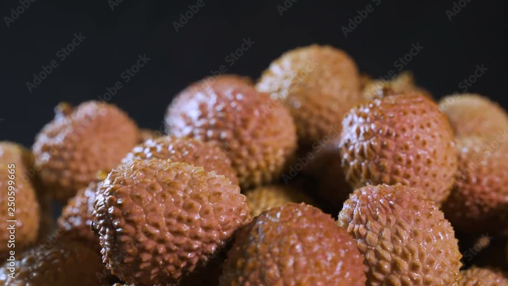 Fruits of thai frkuta litchi on a black background. Fruits of thai frkuta litchi on a black background.