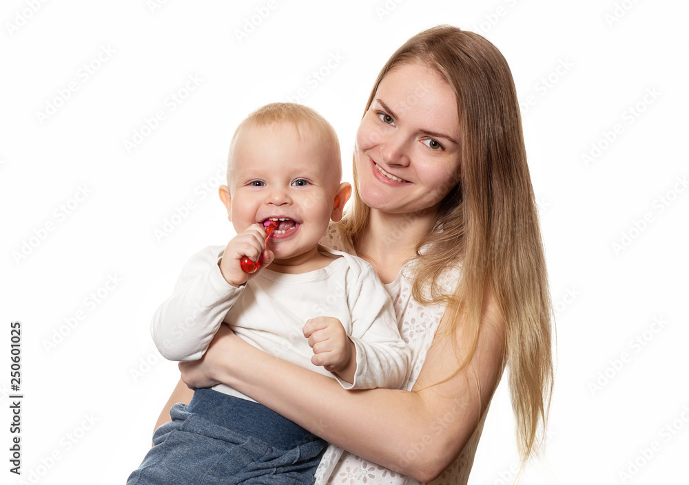 Mother teaching baby teeth brushing. Boy brushing his teeth with a toothbrush for infant. Isolated portrait Mother teaching baby teeth brushing. Boy brushing his teeth with a toothbrush for infant. Isolated portrait