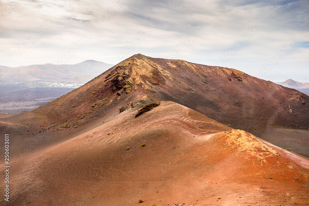 Naklejka premium Amazing lunar landscape of Timanfaya National Park on the volcanic island of Lanzarote in Spain.