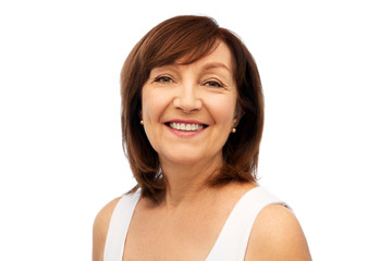 beauty and old people concept - portrait of smiling senior woman over white background