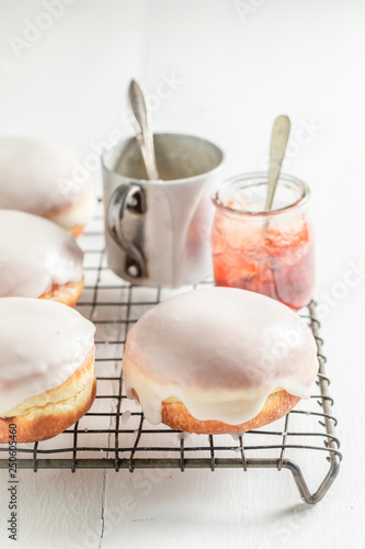 Delicious and sweet donuts with red jam
