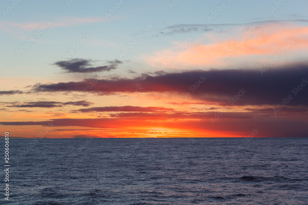 sunrise with clouds on the ocean