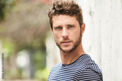 Seriously handsome guy looking at camera