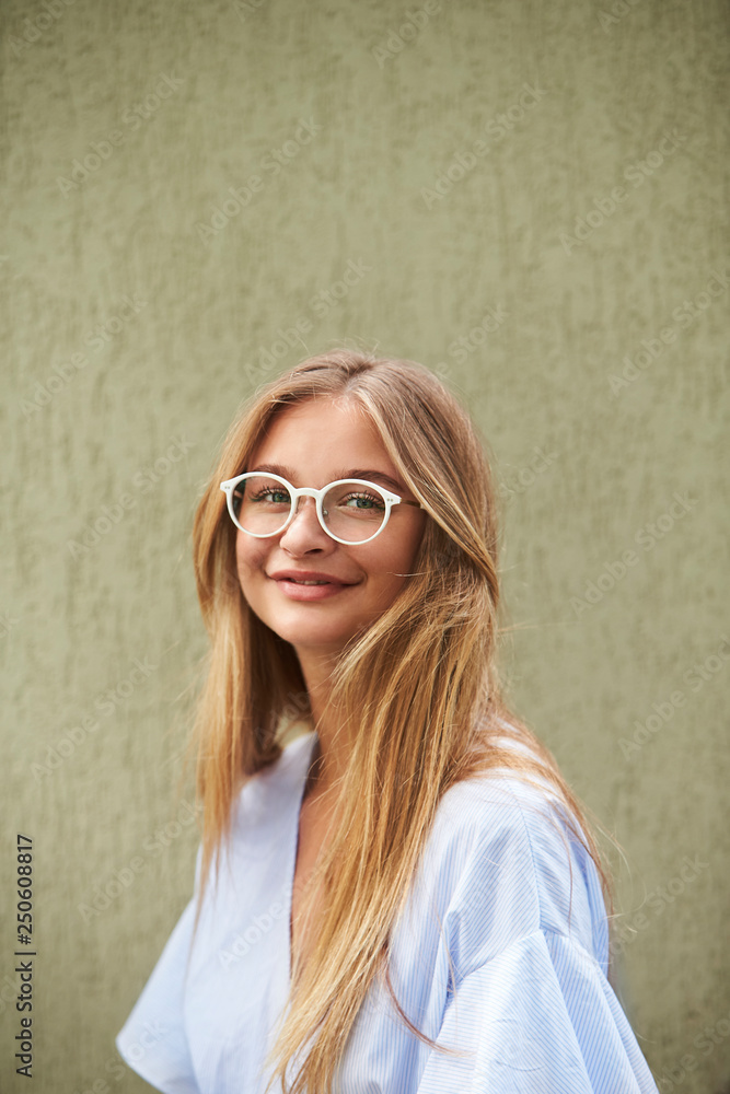 Fototapeta premium Young beautiufl woman smiling glasses, portrait