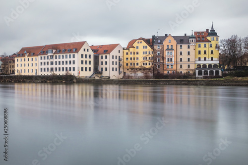 Regensburg, Germany - January 2019: Architecture of Old Town of Regensburg city on the rive Danube. Long exposure. © George