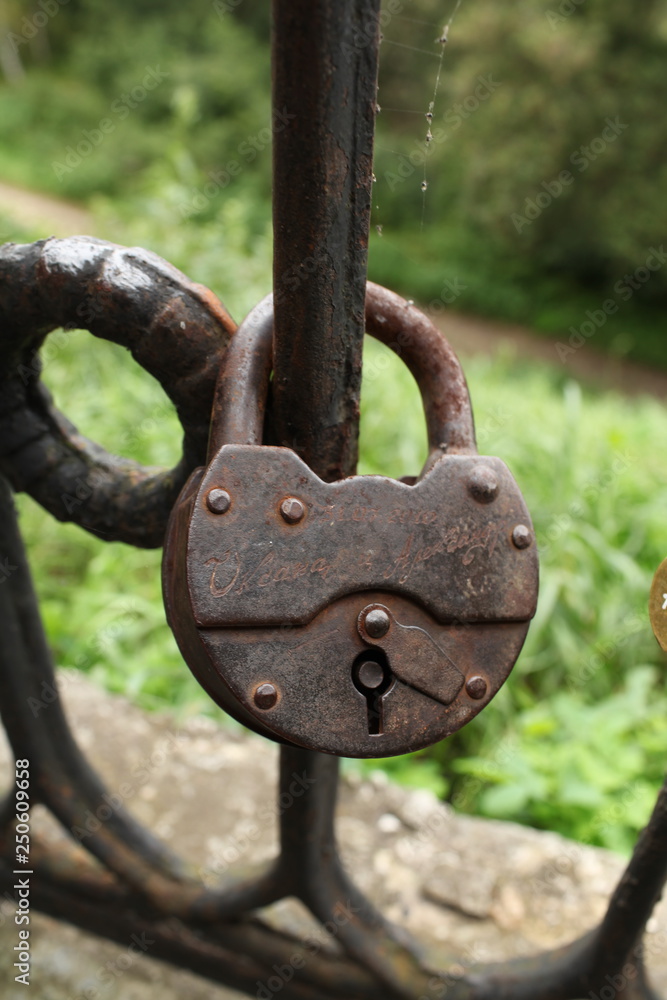 padlock on the railing bridge for the happiness of newlyweds padlock on the railing bridge for the happiness of newlyweds