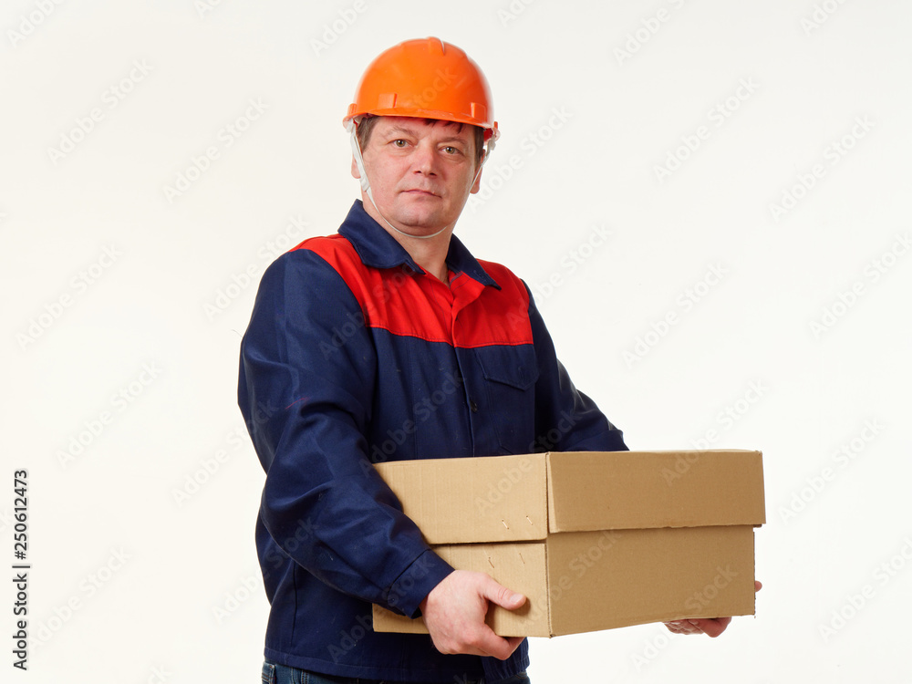 man holds in his hands a big box on a white background. man holds in his hands a big box on a white background.