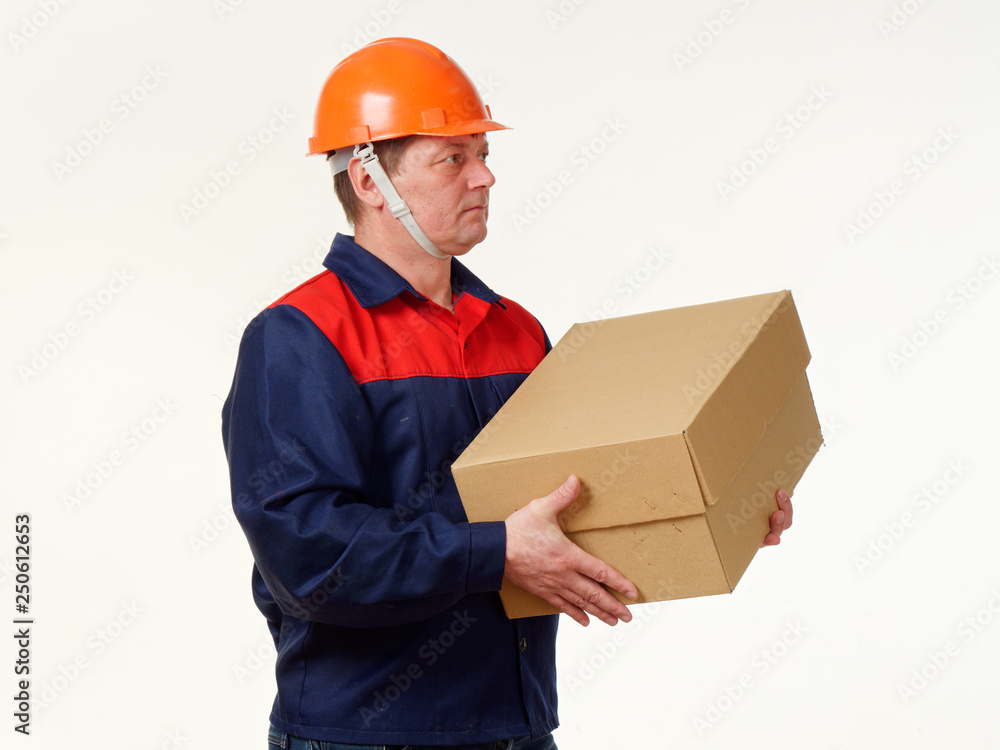 man holds in his hands a big box on a white background. man holds in his hands a big box on a white background.