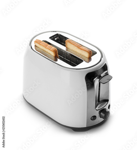 Toaster with bread slices on white background