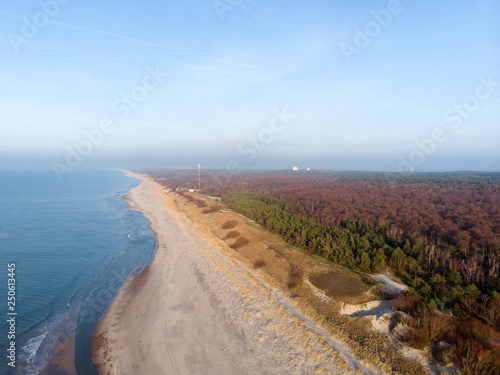 Curonian Spit and the Baltic Sea. View from the copter. Coastline with the beach and the sea. Nature conservation. View from the sky. The photo was taken by drone quadcopter.