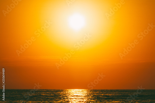 summer sea landscape with orange sky at sunset