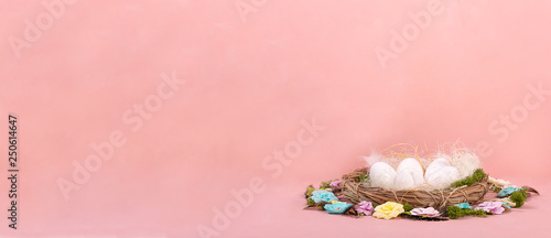 Spring mood, Easter decor of eggs, paper flowers, a wreath of vines on a Living Coral background. Wide banner - Image.