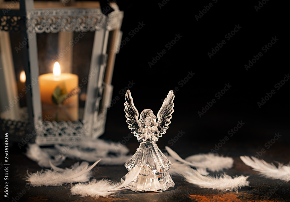 Fototapeta premium Glass angel on a dark background
