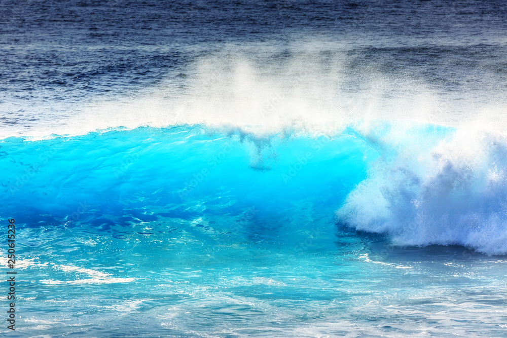 Fototapeta premium Beautiful seascape view of the big blue surf waves of the Atlantic ocean on the island Madeira, a popular surfing tourist destination
