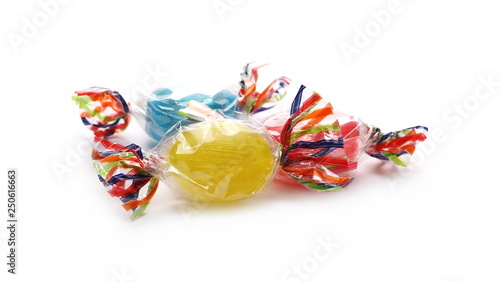 Colorful hard candies in transparent cellophane wrapping, isolated on white background