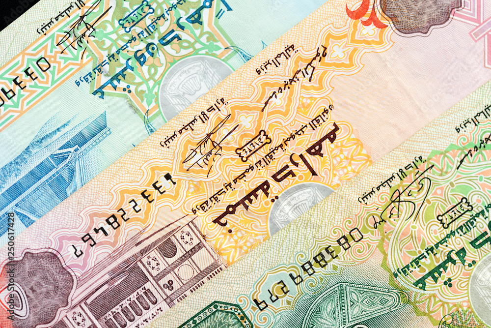 Obraz premium UAE dirham currency notes on a dark background close up
