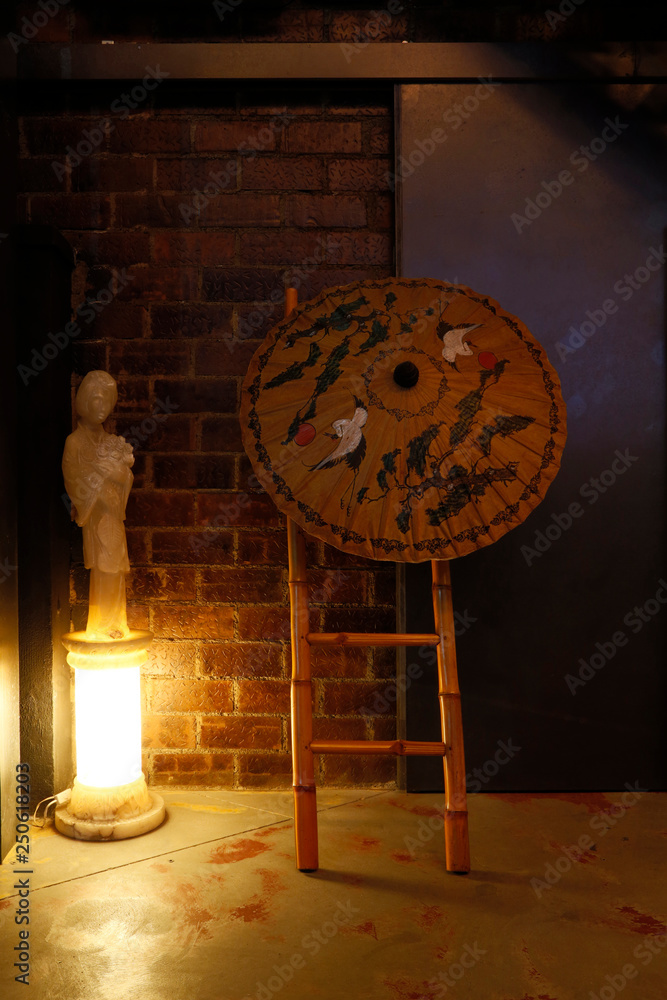 decoration with umbrella and bamboo staircase and lamp