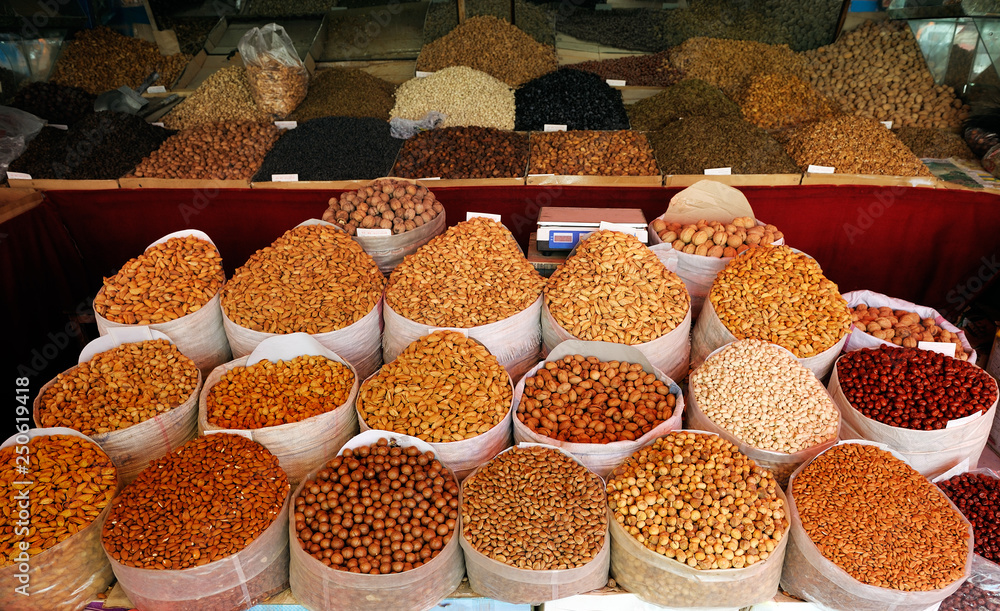 Fototapeta premium Dried nuts and fruits at popular market in Kashgar, Xinjiang, China.