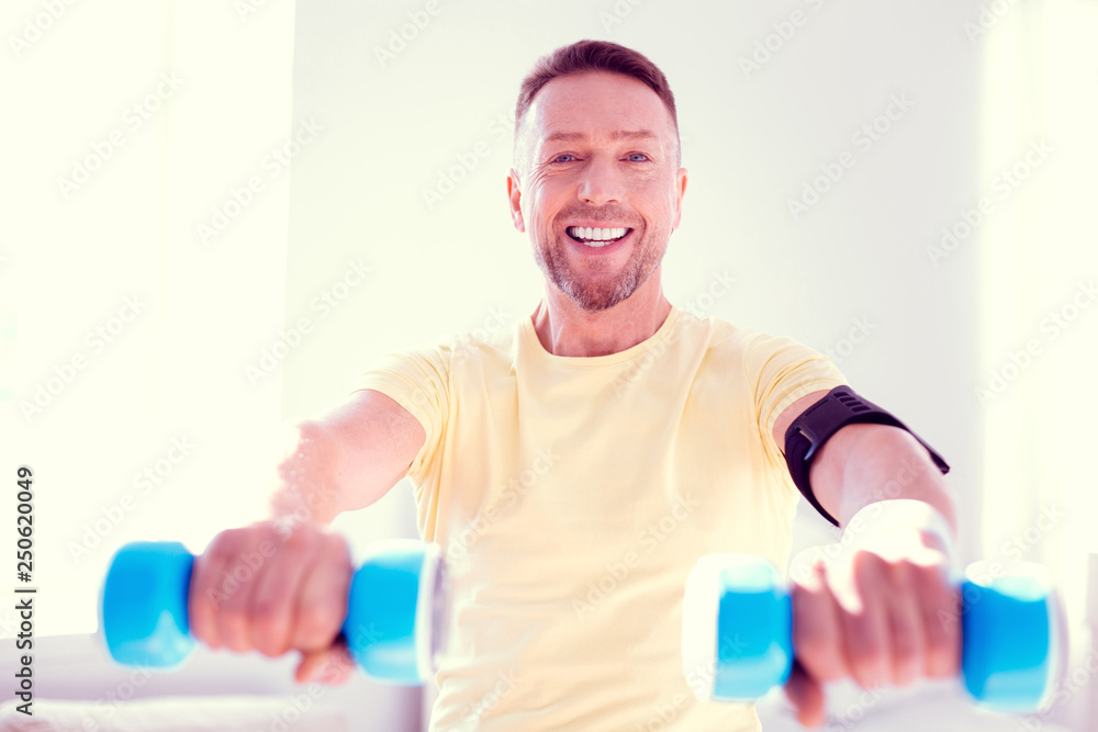 Beaming smiling businessman feeling motivated and energetic doing morning sport Beaming smiling businessman feeling motivated and energetic doing morning sport