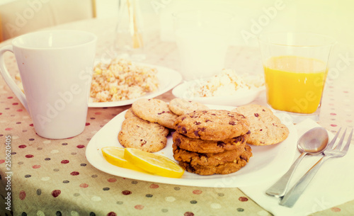 still life of milk, biscuits, porridge from cereals photo