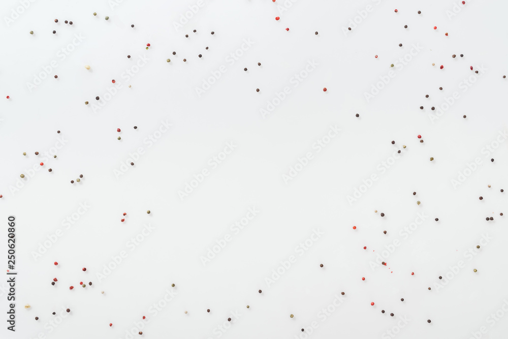 top view of red and black peppercorns isolated on white