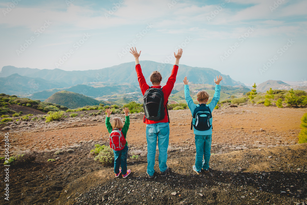 happy father with kids travel in mountains