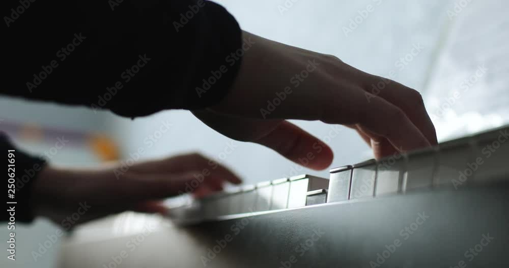 female hands playing the piano, super close-up female hands playing the piano, super close-up