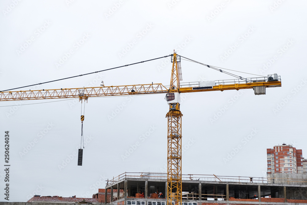 the high crane at a construction site