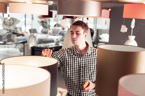 Stickler for detail thirtysomething mister purchasing lamp in store