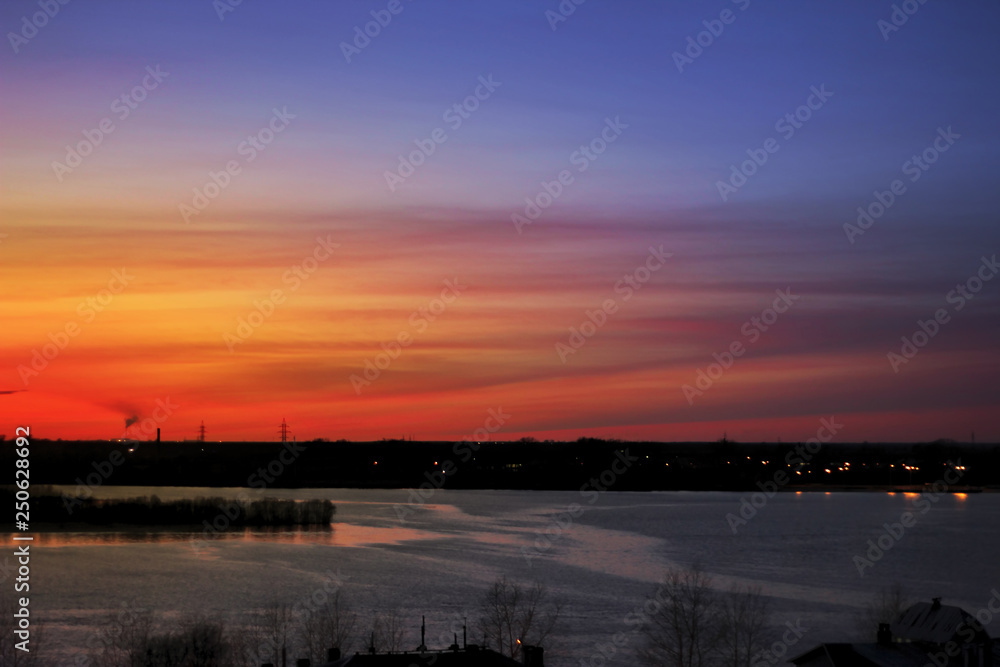 Sunset on the river - night landscape, cloudy sky