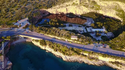 Aerial drone, bird's eye view video from iconic lake Vouliagmeni famous for healing abilities, Athens riviera, Attica, Greece photo