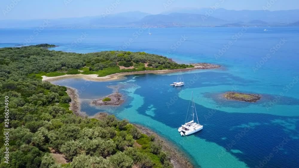 Aerial view video from famous organised beach in small island of Monolia part of archipelago paradise exotic islands of Lihadonisia with clear turquoise sea beaches, North Evoia island, Greece Aerial view video from famous organised beach in small island of Monolia part of archipelago paradise exotic islands of Lihadonisia with clear turquoise sea beaches, North Evoia island, Greece