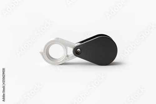 Magnifying glass for diamonds or see the amulet Isolated on a White Background.